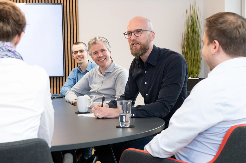 Employees during a meeting in the conference room