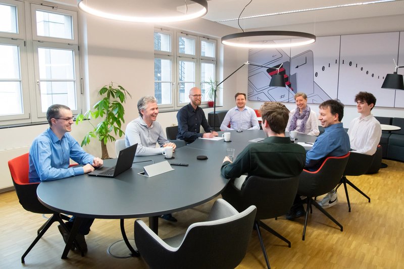 Employees during a meeting in the conference room
