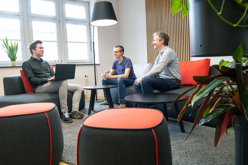 Employees during a discussion in the kitchen